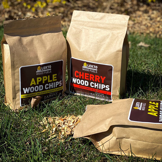 Bags of Apple Wood Chips and Cherry Wood Chips on grass