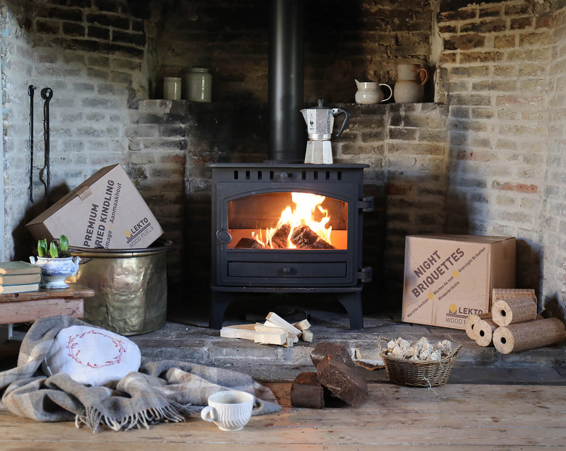 Wood Burning Stove in a rustic setting with a metal Coffee maker on top 